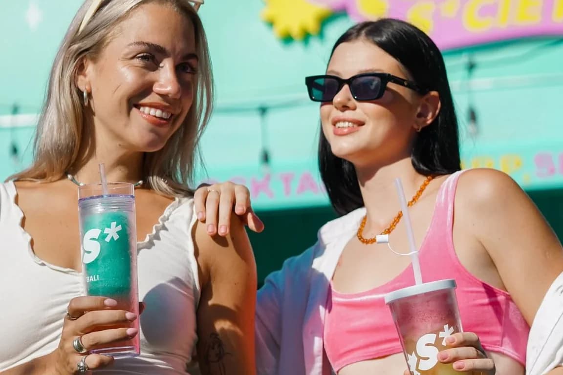 Two girls having their cocktail slushy in Slushy S*ciety