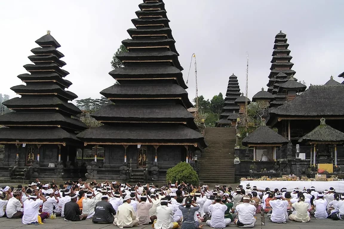 Balinese people praying in Besakih temple complex
