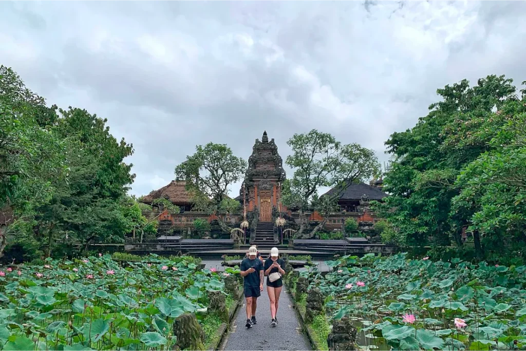 Tourists visiting pura teman kemuda saraswati