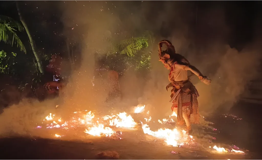 hanuman dancer in the middle of fire in a kecak dance performance in Tanah Lot temple