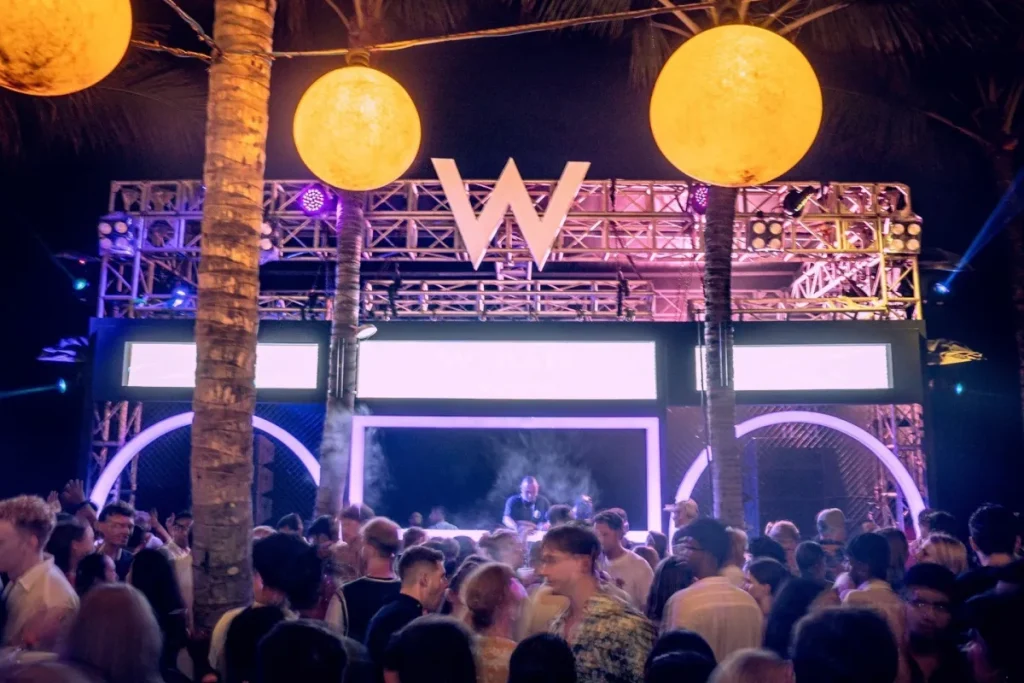 a crowd of people at a DJ performance at WooBar Seminyak Bali